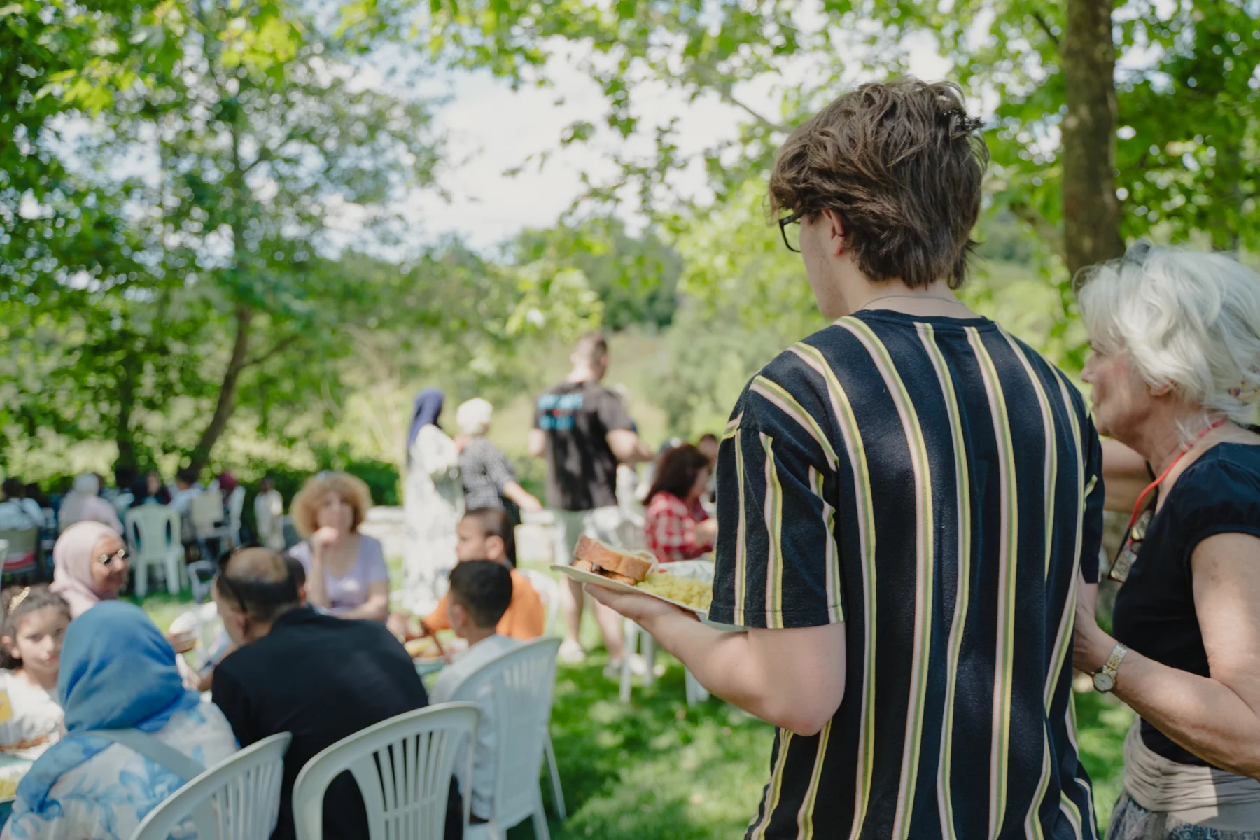 A LeapYear student serving a community meal during the international experience