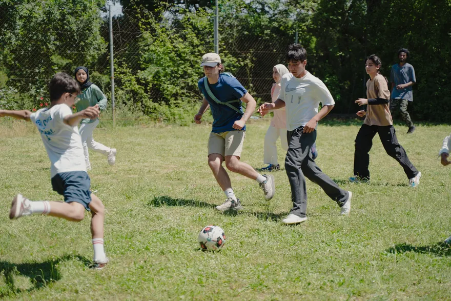 LeapYear students playing soccer with local children during the international service trip